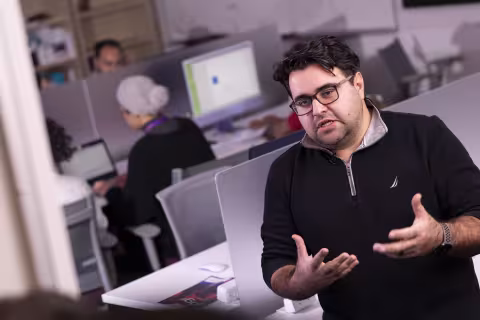 M. Abdullah Canbaz leads an interview inside CEHC's AI in Complex Systems Laboratory.