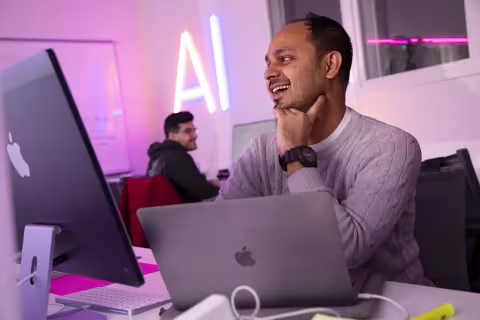 Students collaborate inside CEHC's AI in Complex Systems Laboratory.