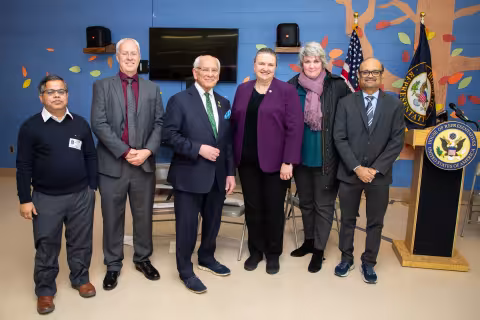 UAlbany faculty and staff stand with Congressman Tonko at the Giffen Memorial Elementary School.