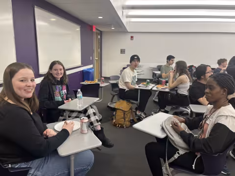 Faculty and staff from UAlbany's Department of Mathematics and Statstics celebrates Pi Day on March 14 with pizza.