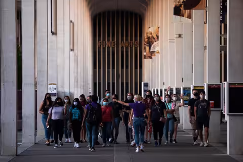 Students walking around campus on a tour.