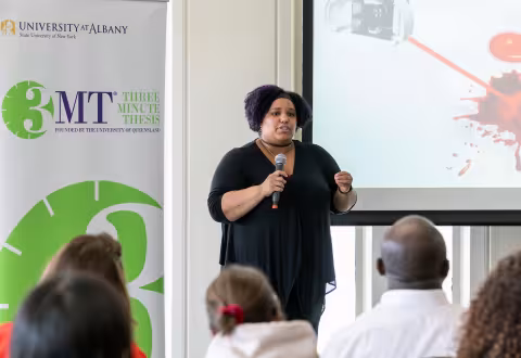 Alexis Weber, who is pursuing her PhD in analytical chemistry, presents at the 3-Minute Thesis competition.