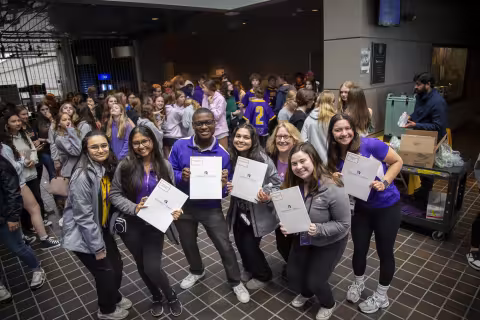 Students show off their certificates during Showcase Day 2024.