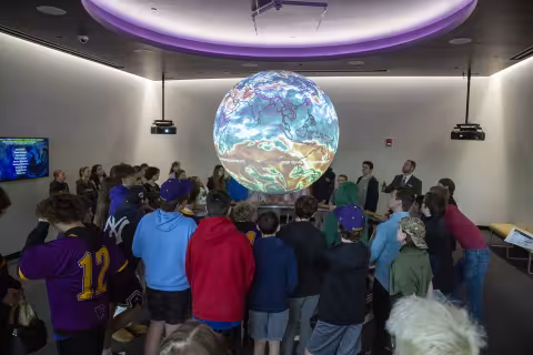 Several middle school students visit the Sphere Room at ETEC on Showcase Day 2024.