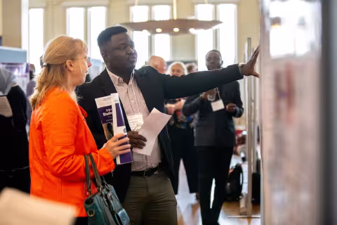 A student shows his work during Showcase Day 2024.