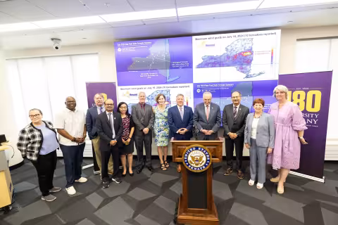 Senator Schumer stands for a photo with UAlbany community members and local elected officials after a press conference at ETEC.