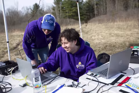 UAlbany seniors David Zywiczynski (left) and Alan Birnbaum review data on laptops at Fort Drum.