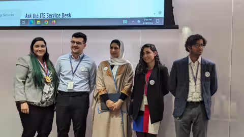 Group of information science doctoral students answering audience questions.