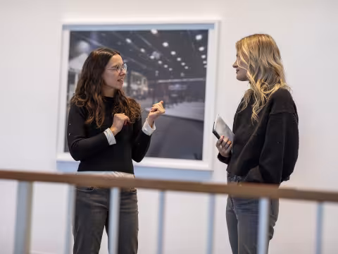 Students discussing artwork