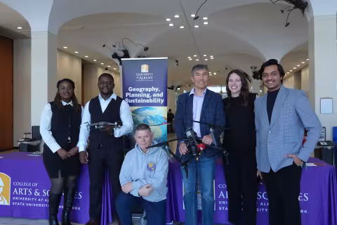 Faculty and students take a photo together at UAlbany's GIS Day celebration.