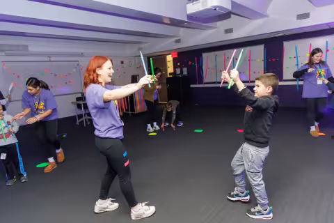Children and volunteers participate in games and activities.