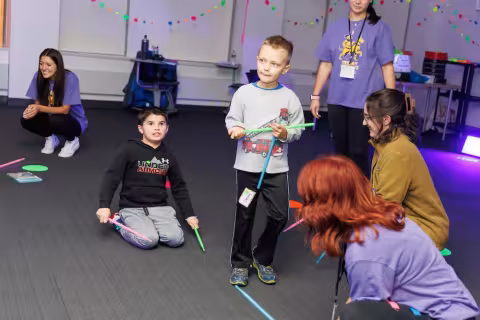 Children and volunteers participate in games and activities.