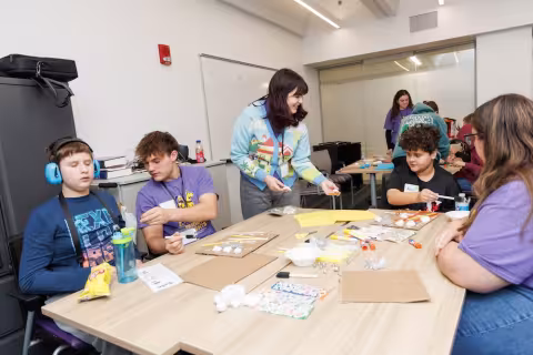 Children and volunteers participate in games and activities.