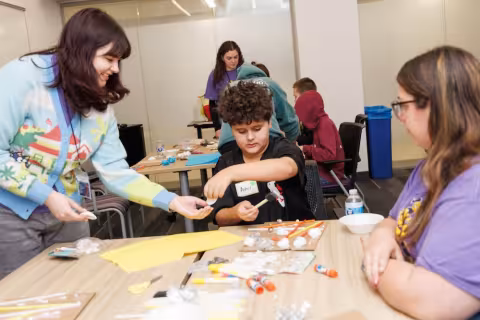 Children and volunteers participate in games and activities.