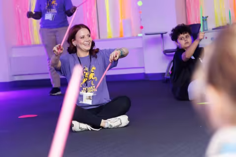 Children and volunteers participate in games and activities.