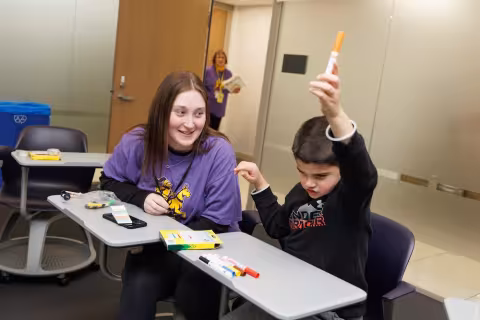 Children and volunteers participate in games and activities.