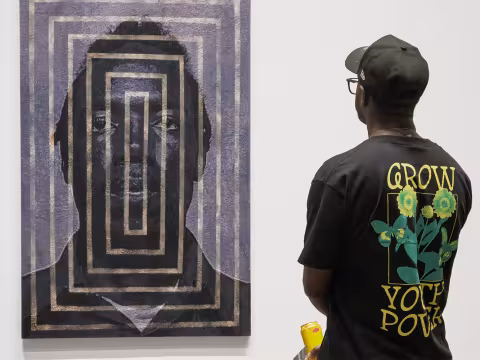 Visitor standing in front of painting