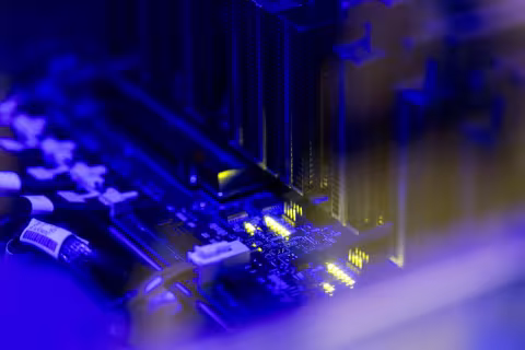 A close up of the circuitry and components inside a computer server rack.