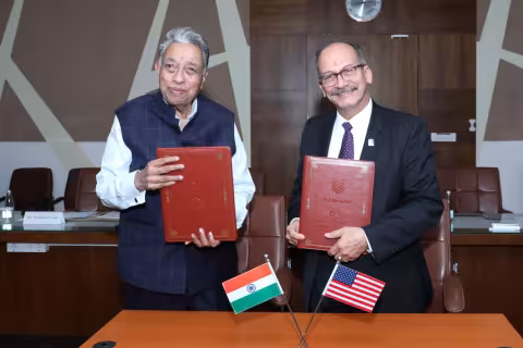 Leadership at RUAS and UAlbany hold up signed agreements