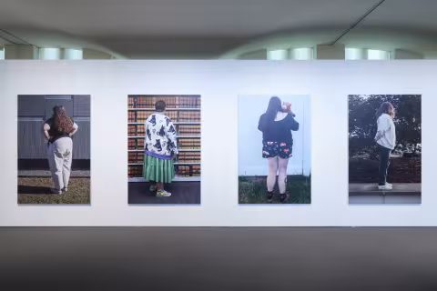 Large scale dibond prints of the backs of figures