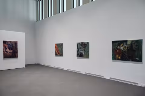 Four oil paintings on a wall