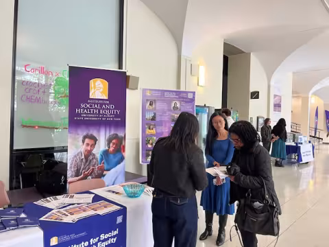 Attendees at UAlbany 2026 Showcase Day with Institute for Social and Health Equity (ISHE) staff and (in middle) Tianning Huang, Director of Office of Strategic Initiatives at UAlbany.