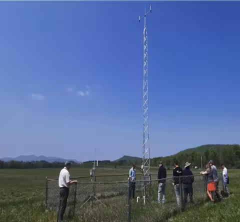 Mesonet researchers visit the weather tower located on Uihlein Farm in Lake Placid.