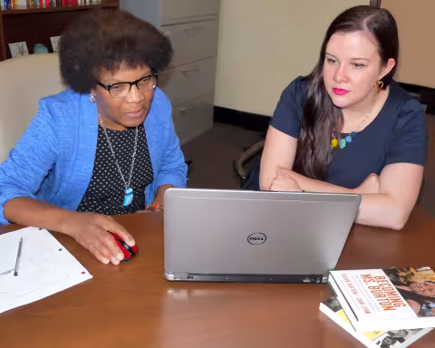 Frankie Bailey conducting research with a student