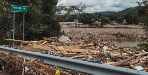The Nolichucky River packed with wood, household items and other storm debris from Hurricane Helene.