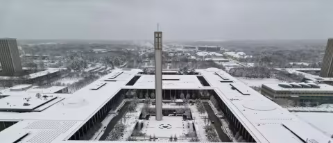 The Uptown Campus covered in snow, photographed from a drone.