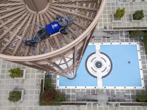 Damien lays at the top of the Carilion with his legs crossed.