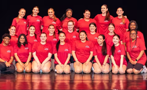 University at Albany Dance Council group pose in matching dance outfiles.