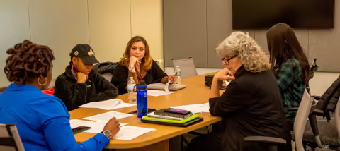 group of women meeting around table