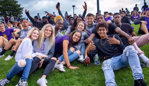 A group of students at an athletics game.