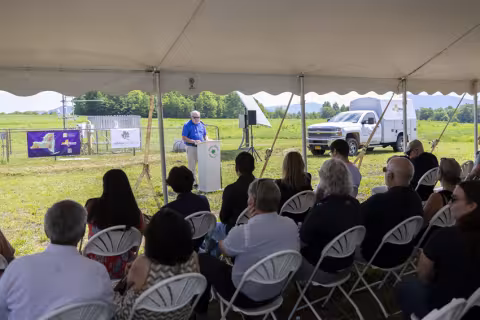 James McKenna, board member of the Uihlein Foundation, offers welcome remarks to attendees in front of the Lake Placid Mesonet site.