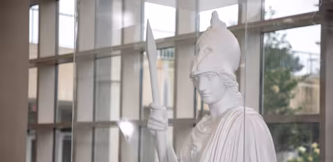 A white plaster statue of the Greek goddess of knowledge, Minerva.