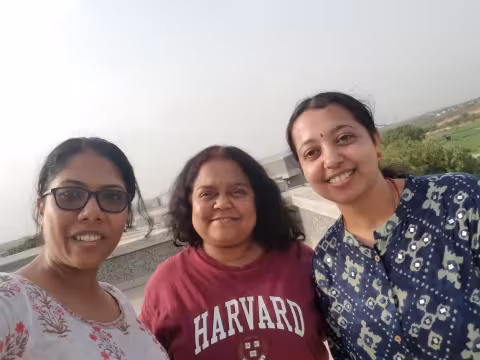 A selfie of three women outside.
