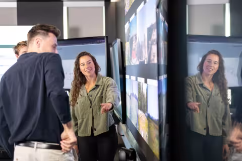 Carly Sutter observes real time camera images of New York State Mesonet sites from inside UAlbany's xCITE lab.
