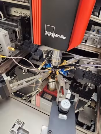 Advanced equipment labeled Suss Microtec is shown in a laboratory setting.