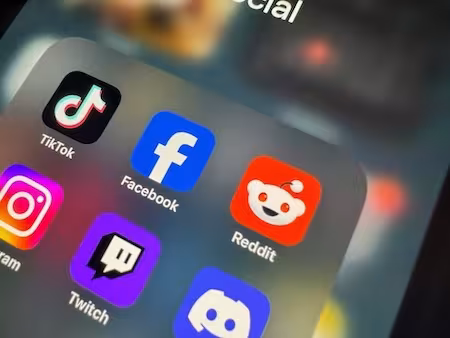 Popular social media apps in a folder labeled "social media" on a phone screen