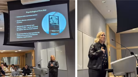 Two images of the same woman wearing a black leather jacket as she presents a slideshow to a room to the group, standing at a silver podium. 