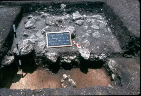An excavation of aceramic deposits discovered under a Terminal classic cobble terrace.