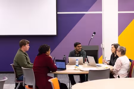 Group laughs at a table