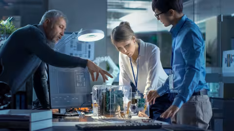 Team of engineers working on instruments in research center