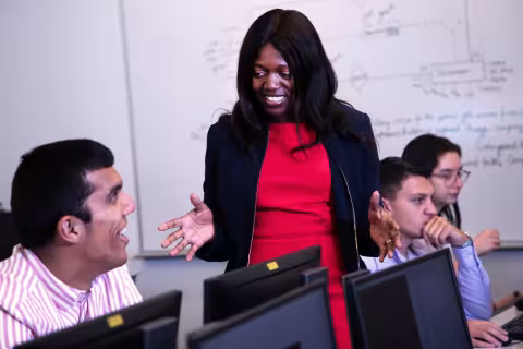 Digital Forensics and Cybersecurity students working in a computer lab