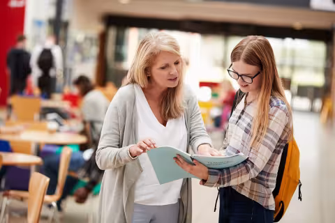 A teacher helping a student