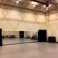 PAC's Dance Studio has high ceilings and a mirror on the side wall