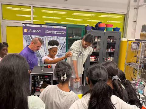 Three young people participate in an activity in the SWIFT Gateway K-12 Program.
