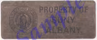 A sample of a New York State asset tag. This tag is brownish gold, with the UAlbany logo and the words "Property of SUNY Albany."