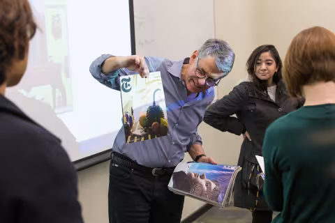 Professor Thomas Bass with UAlbany students in the Entrepreneurial Journalism course 